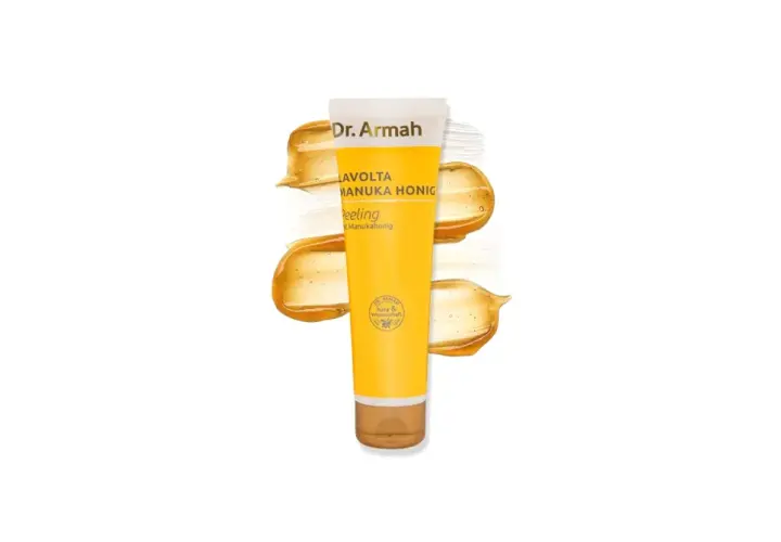 Dr. Armah Manuka Honig Peeling für ein strahlendes Gesicht. Goldene Honig-Textur um die Tube.
